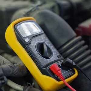 multimeter or voltmeter testing car battery